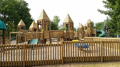 Fence around park play structure